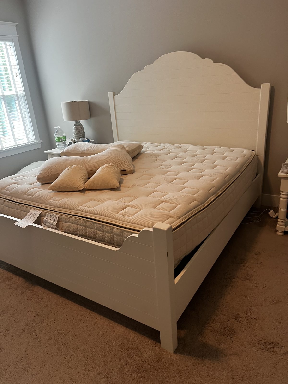 Bed frame assembled and mattress set in place after a delivery
